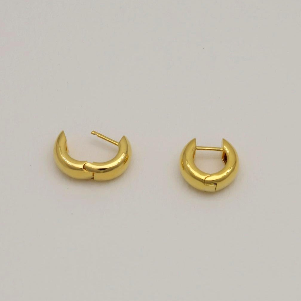 Polished gold vermeil mini hoop earrings with a smooth rounded finish, crafted in Korea.
