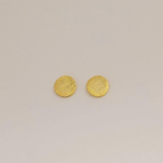Matte gold vermeil disc stud earrings on white background