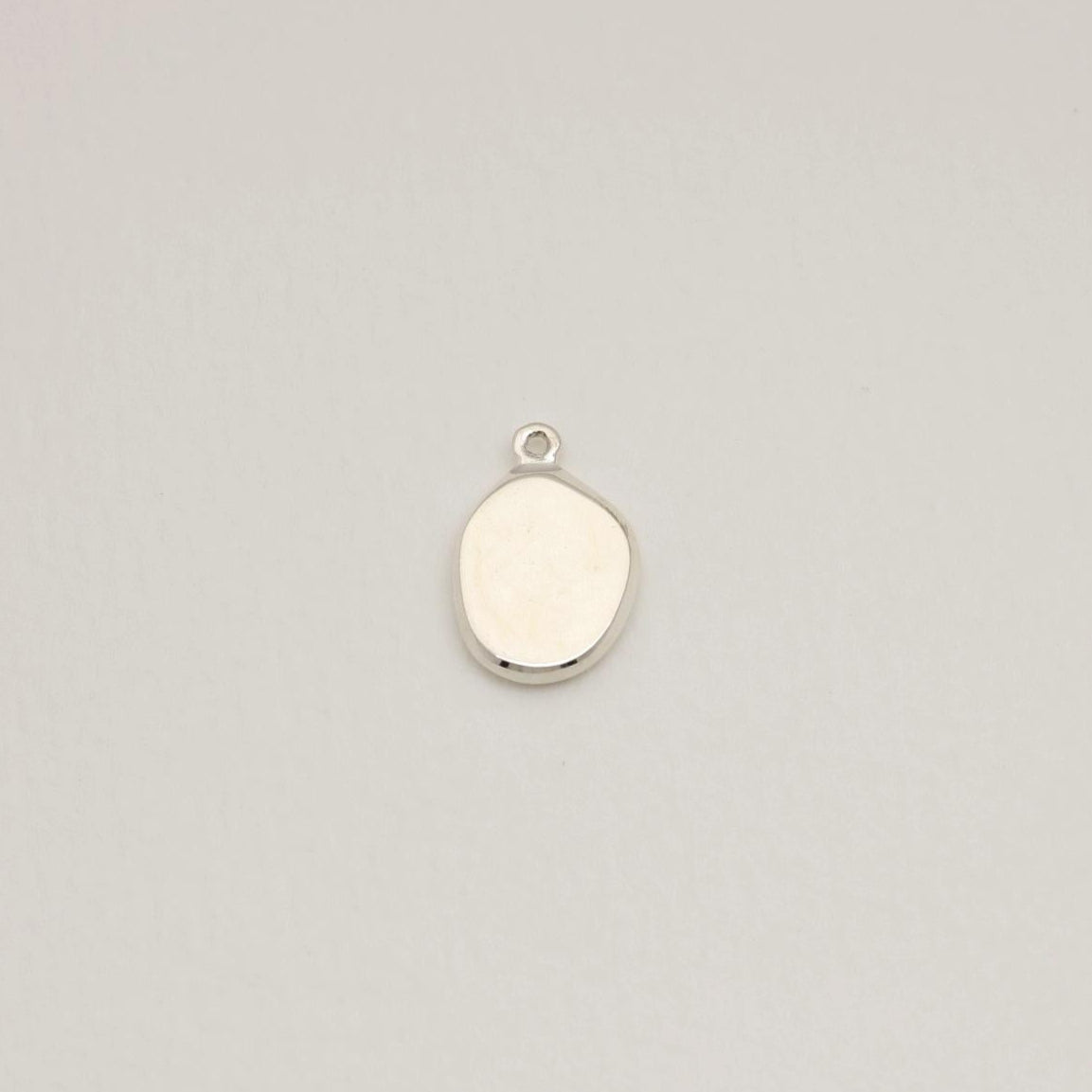 925 sterling silver pendant with an organically rounded shape, polished finish, and engravable surface — photographed on a neutral background.