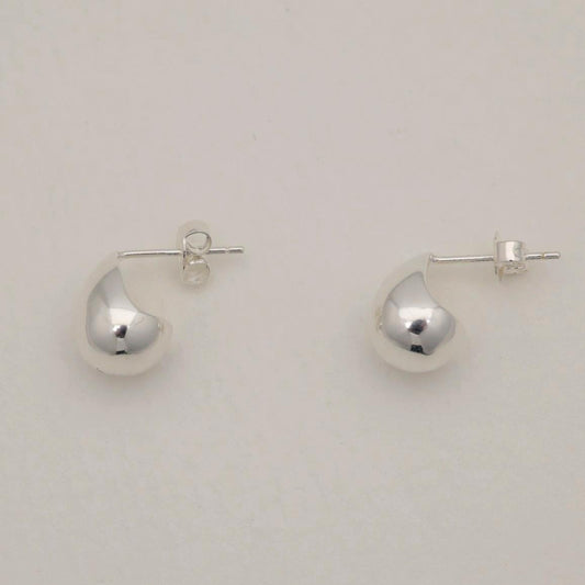 Polished sterling silver teardrop-shaped stud earrings with soft rounded edges and butterfly backs