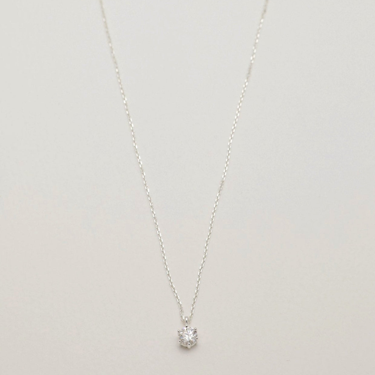 Full view of the Lucille Grande Necklace featuring a large 5-carat moissanite pendant on a 925 sterling silver chain.