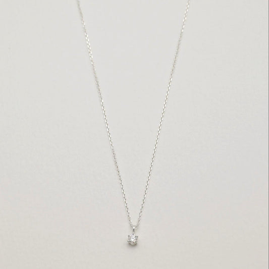 Full view of the Lucille Necklace in 925 sterling silver with a round moissanite pendant.

