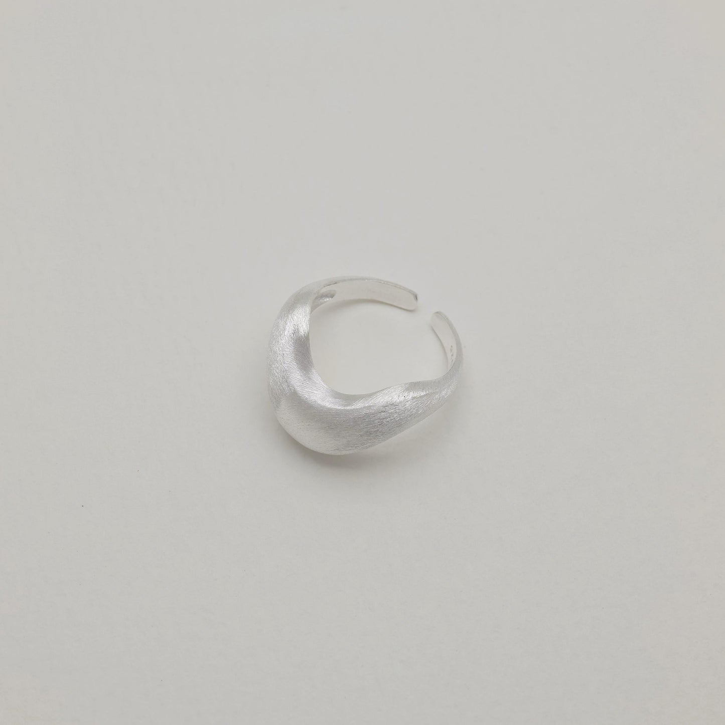 Main image of sculptural silver ring, folded design, polished finish