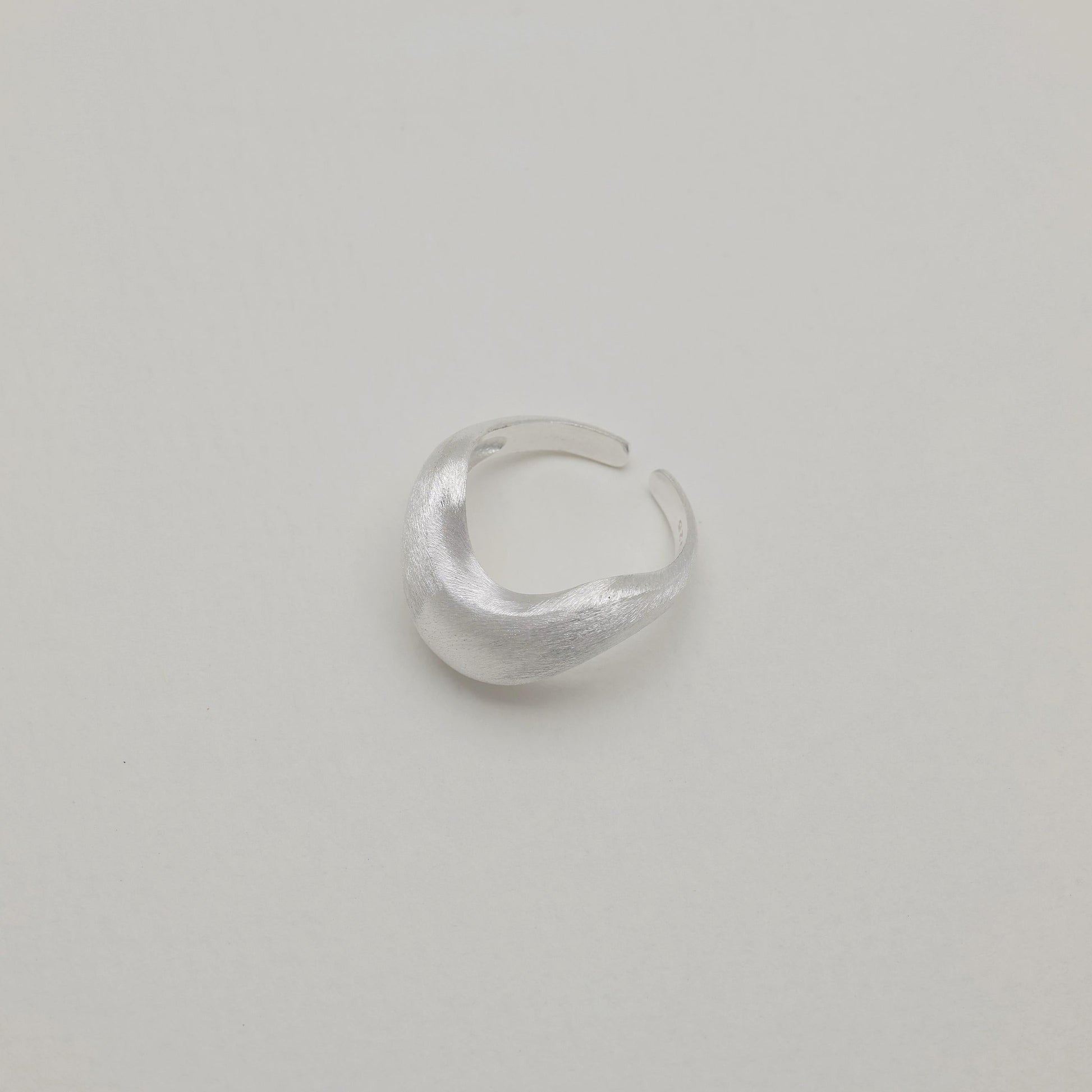 Main image of sculptural silver ring, folded design, polished finish