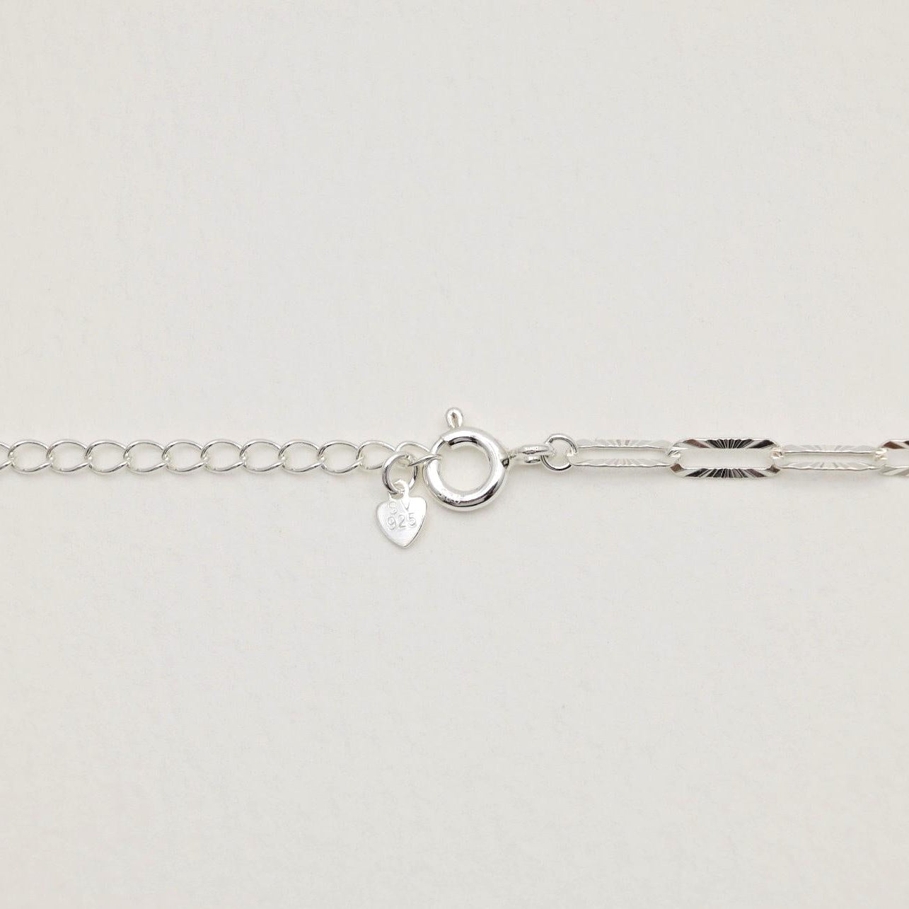 Detail shot of the spring clasp and extender with 925 hallmark tag on the Solène Necklace.


