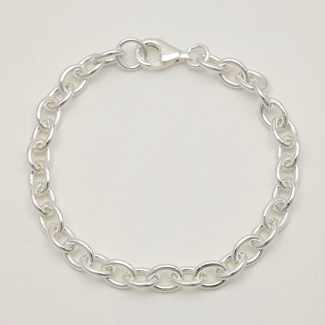 Full view of the Stella Chain Bracelet arranged in a loop on a neutral background.