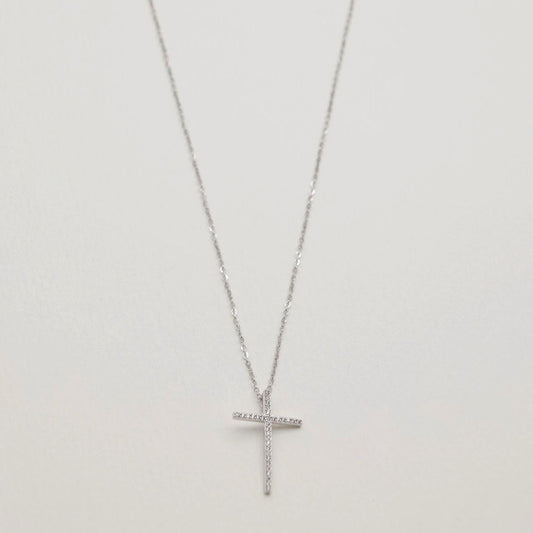 Full view of the Thérèse Necklace featuring a CZ-studded cross pendant on a 925 sterling silver chain.