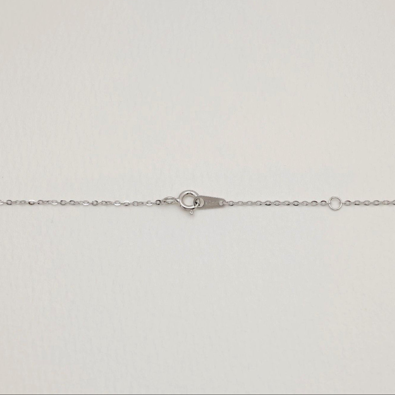 Detail shot of the spring clasp and 925 tag on the Thérèse Necklace in sterling silver.