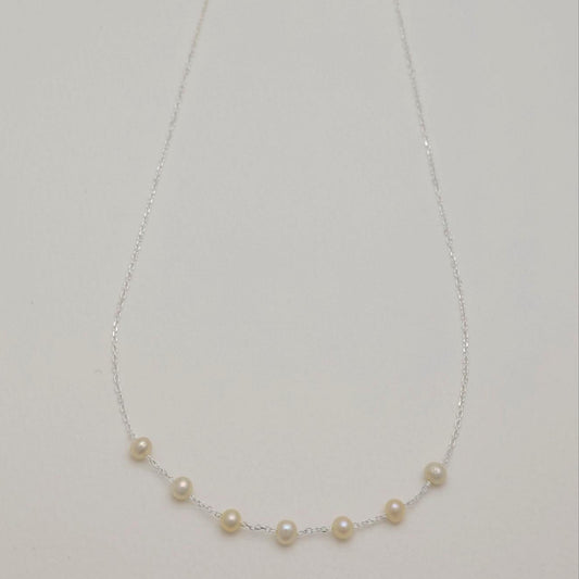 Full view of the Vivienne Necklace in 925 sterling silver, featuring natural pearls on a delicate chain.