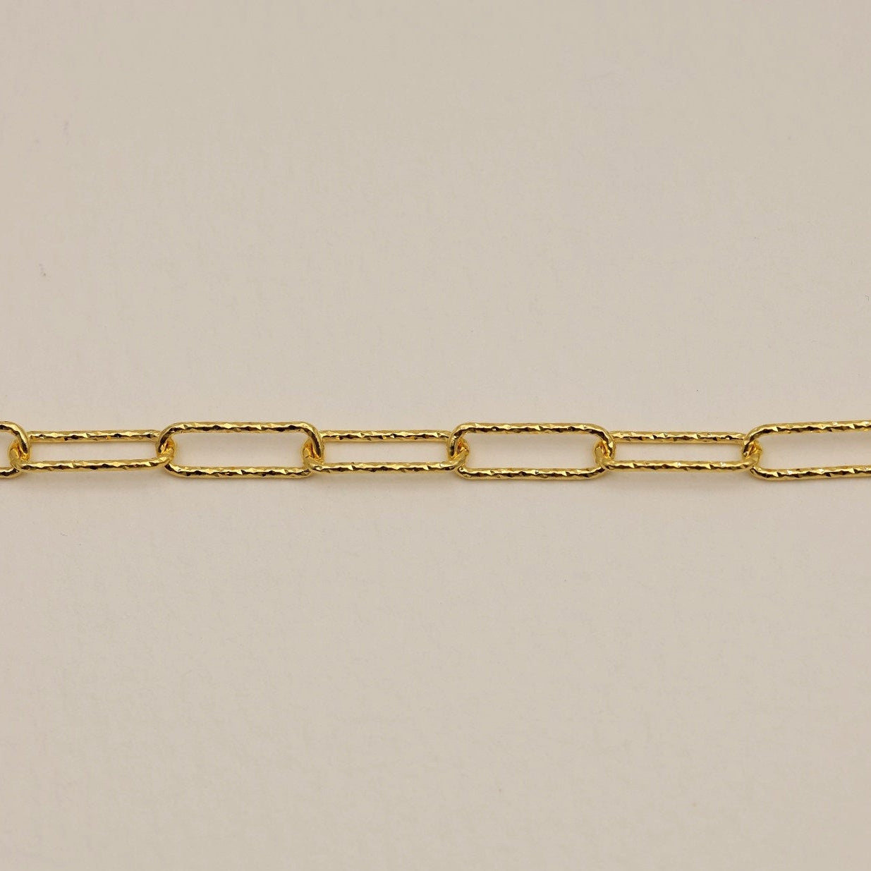The clasp and extender section of the gold vermeil textured chain necklace.