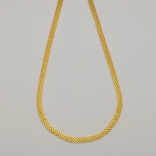 Gold vermeil mesh necklace laid flat showing intricate woven links.