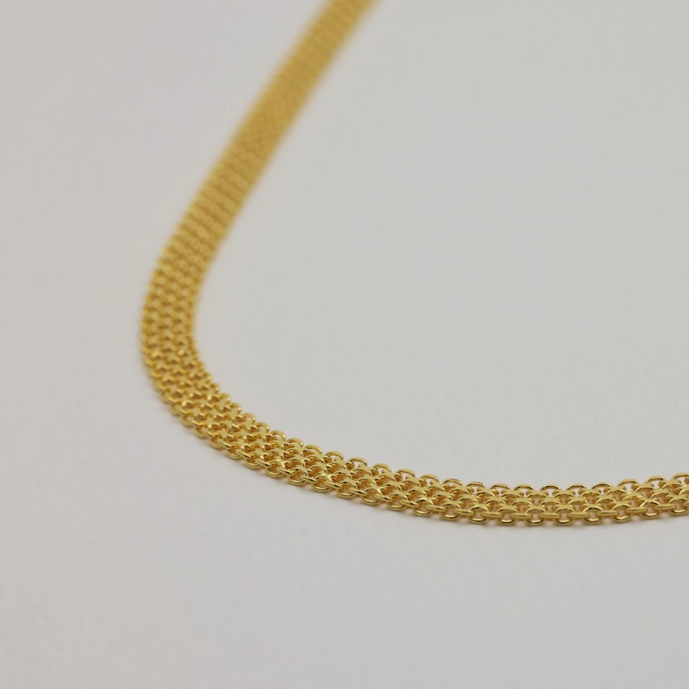 Focused shot of necklace front showing soft shimmer.

