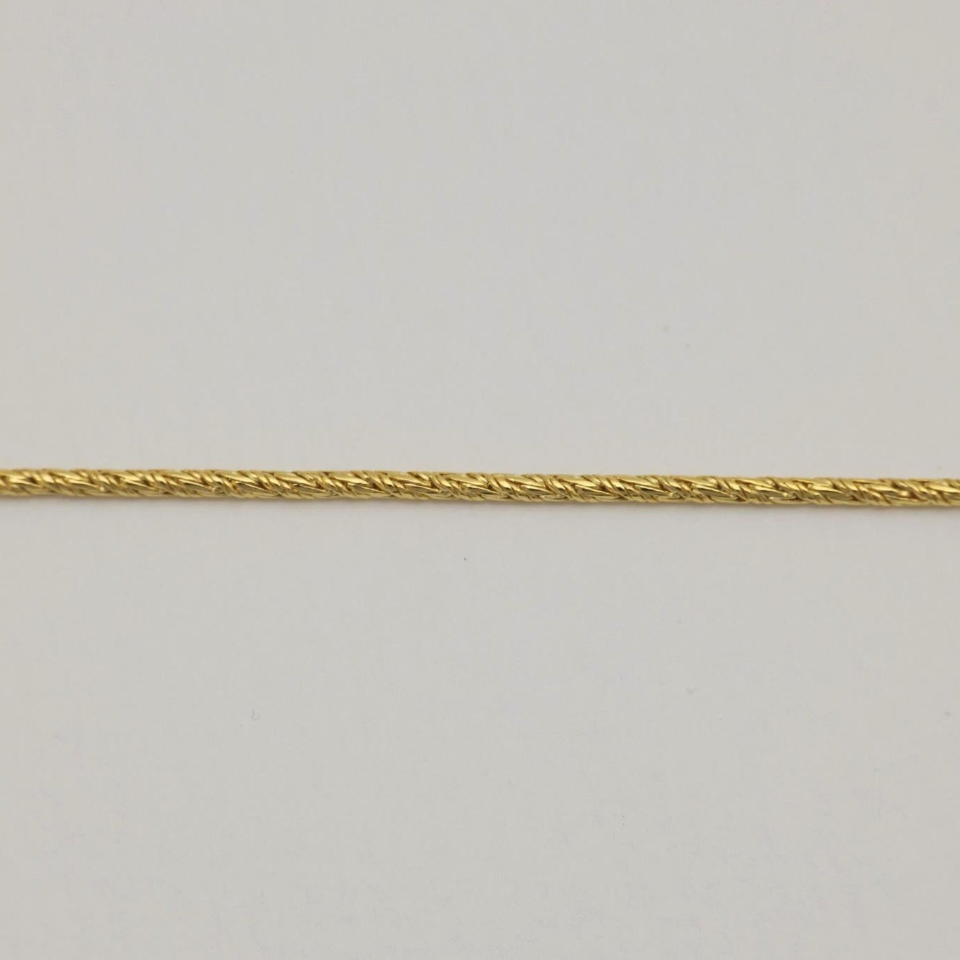 Straight-on view of the gold vermeil rope chain design, showing the intricate twisted texture.