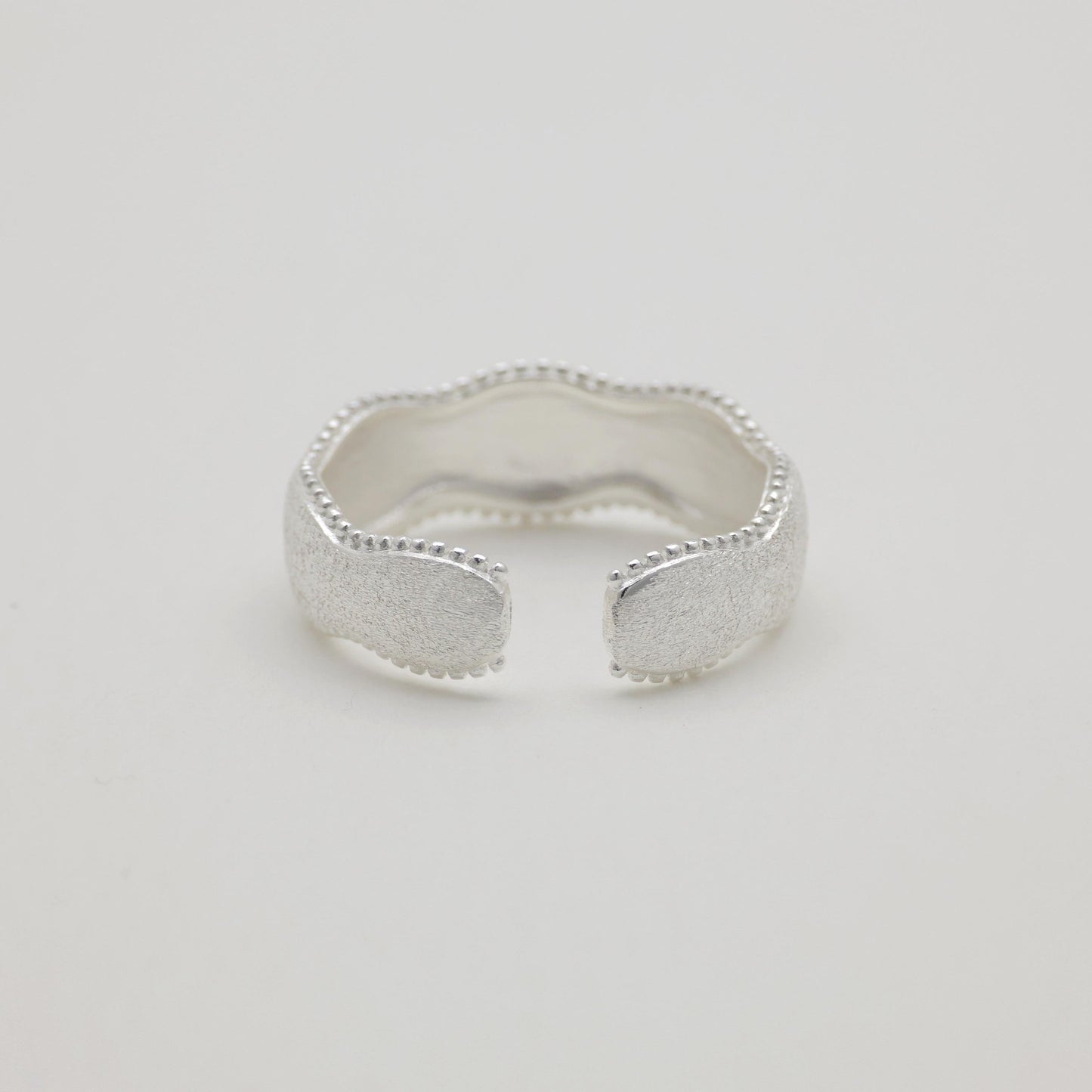 Styled ring shot with soft shadow and natural light

