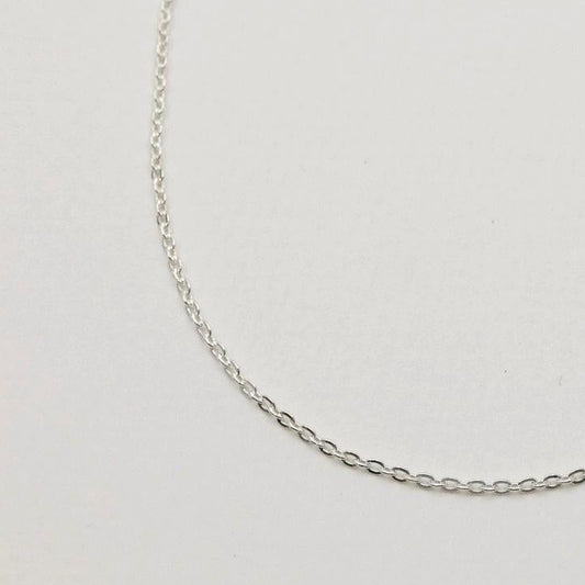 925 sterling silver fine chain necklace, 42cm, shown on neutral background with polished finish and oval links.