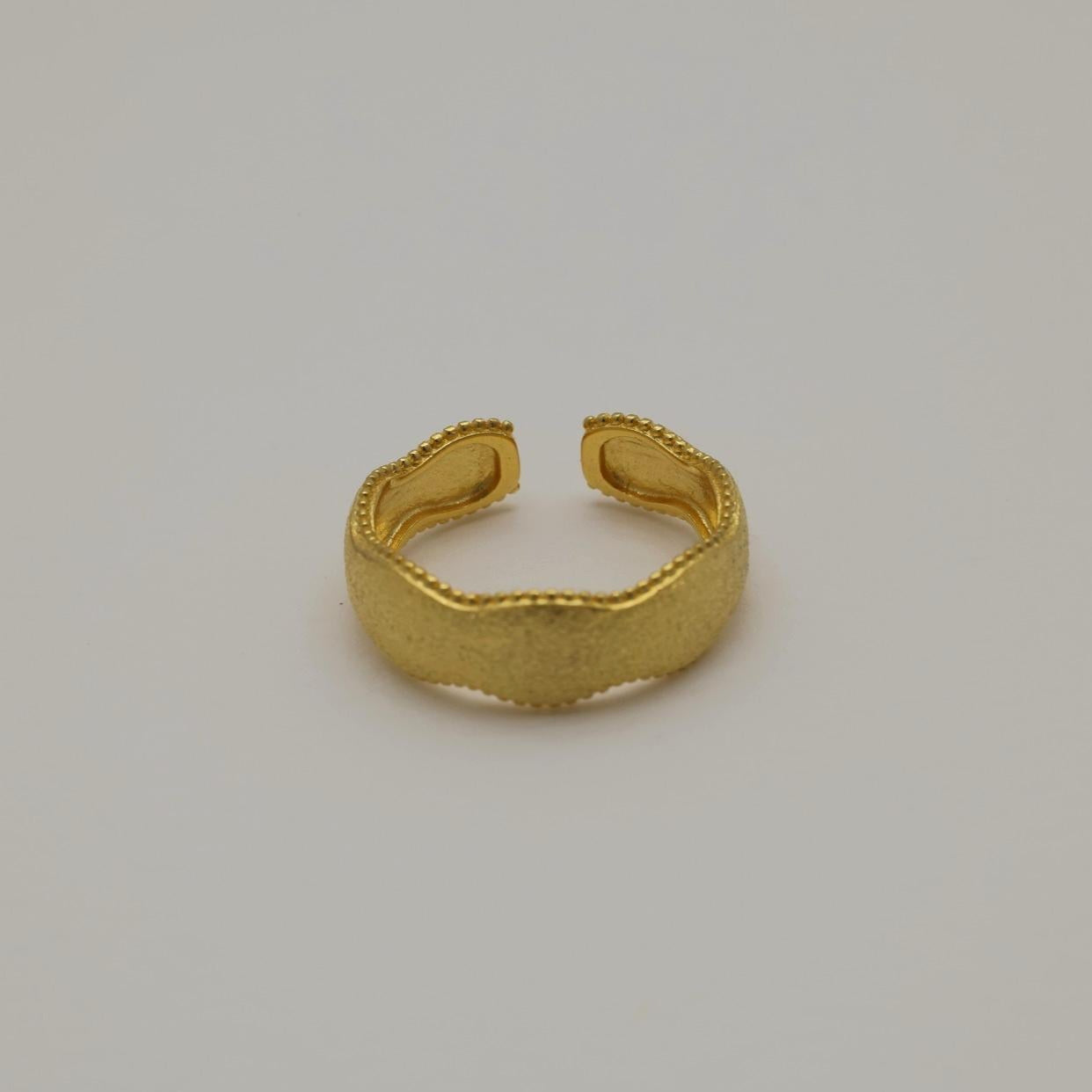 Gold vermeil wavy ring with beaded edges, front view on neutral background.