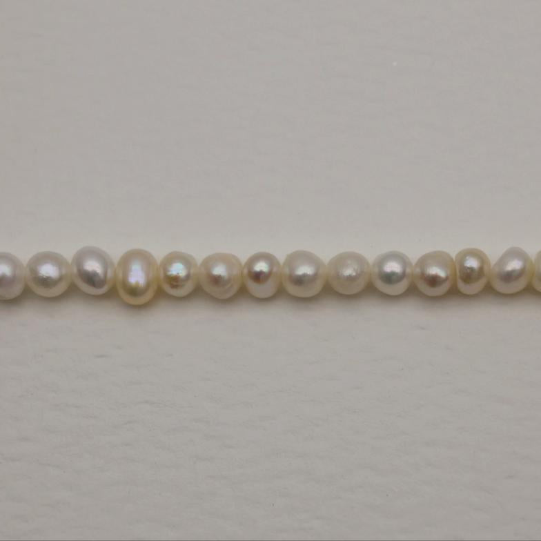 String of pearls on a light gray background