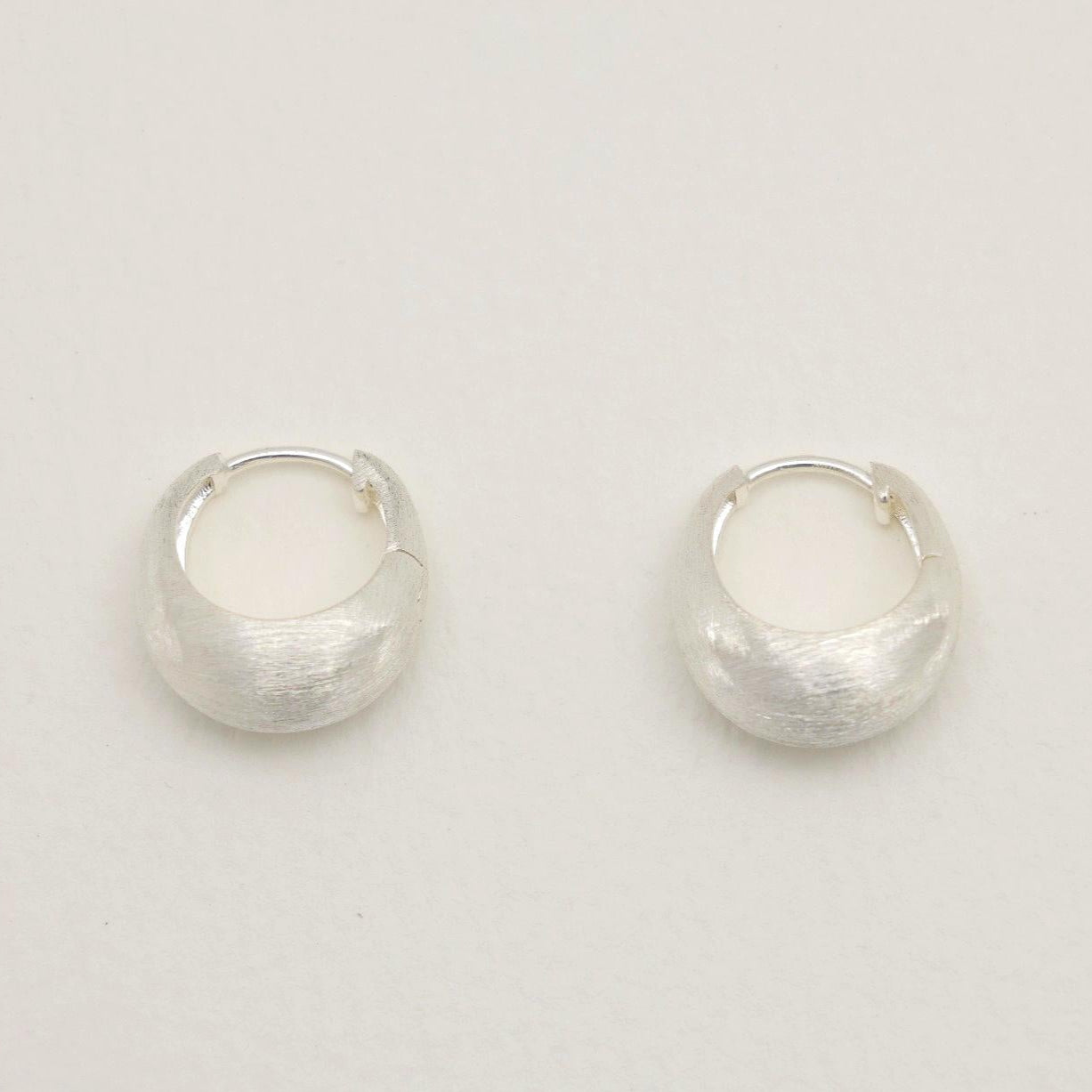 Sterling silver mini hoops with soft brushed finish