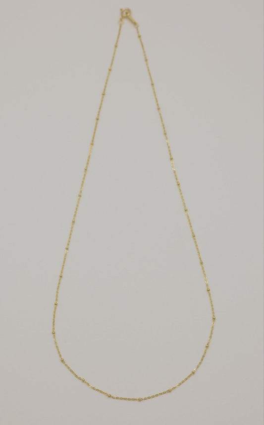 Full view of Maëlle 14K gold necklace with delicate bead accents