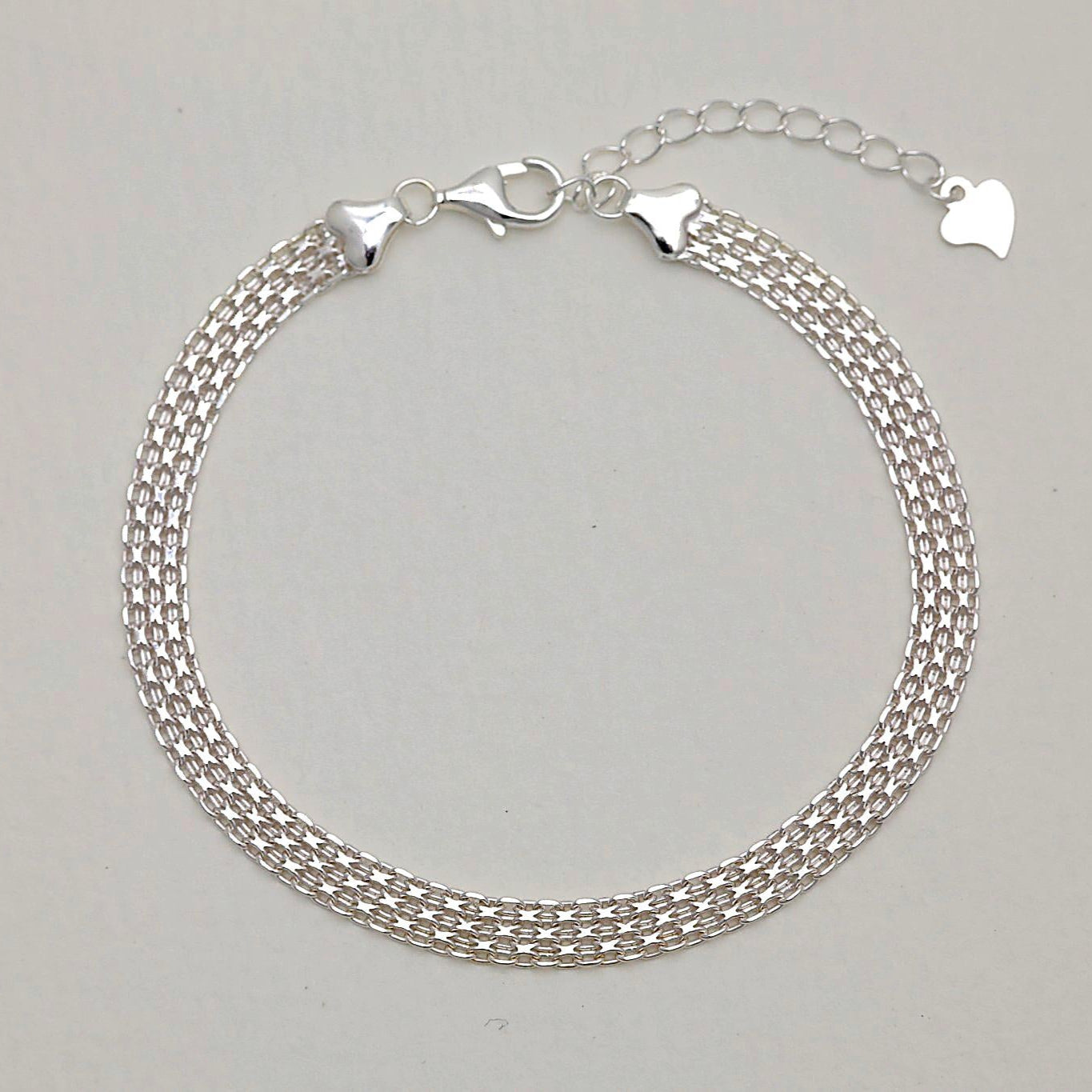 Full view of the Marcelline Bracelet showing its triple woven chain design