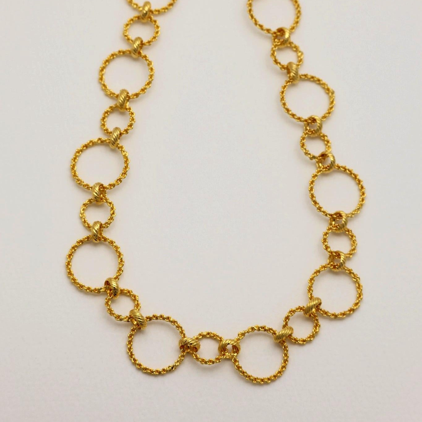 Top-down view of gold vermeil necklace with alternating circle links