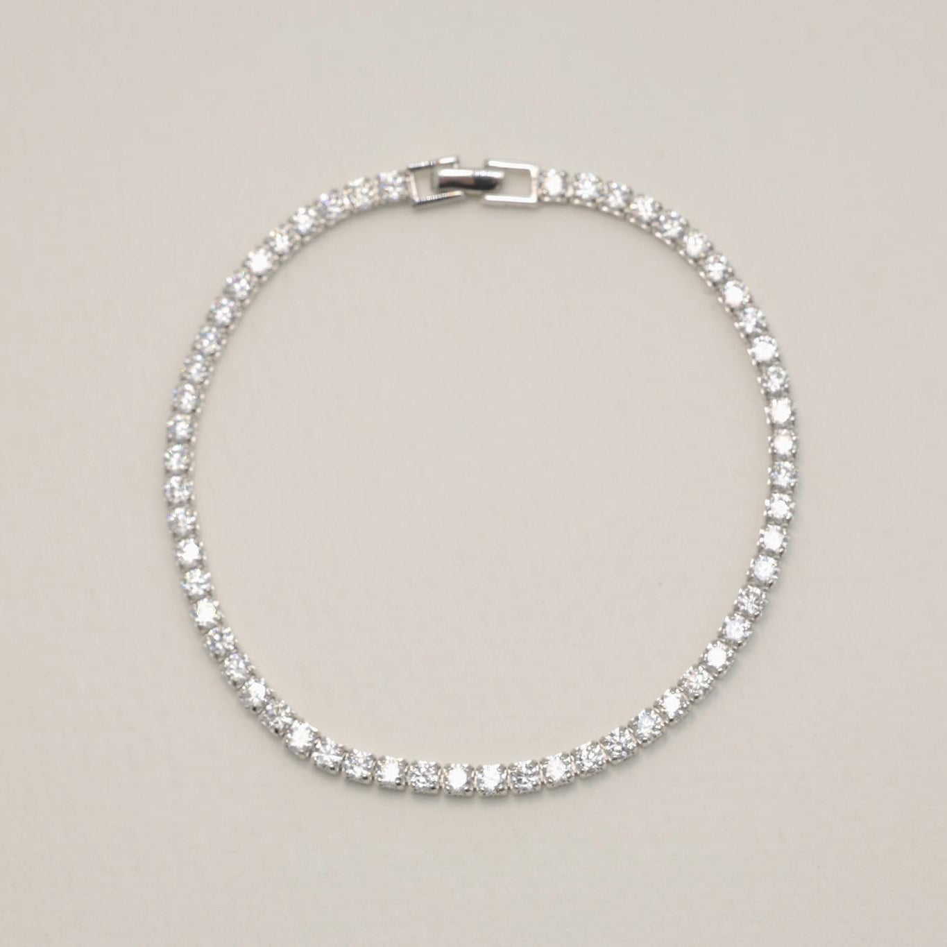 Full view of MOA sterling silver tennis bracelet laid flat