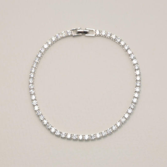 Full view of MOA sterling silver tennis bracelet laid flat