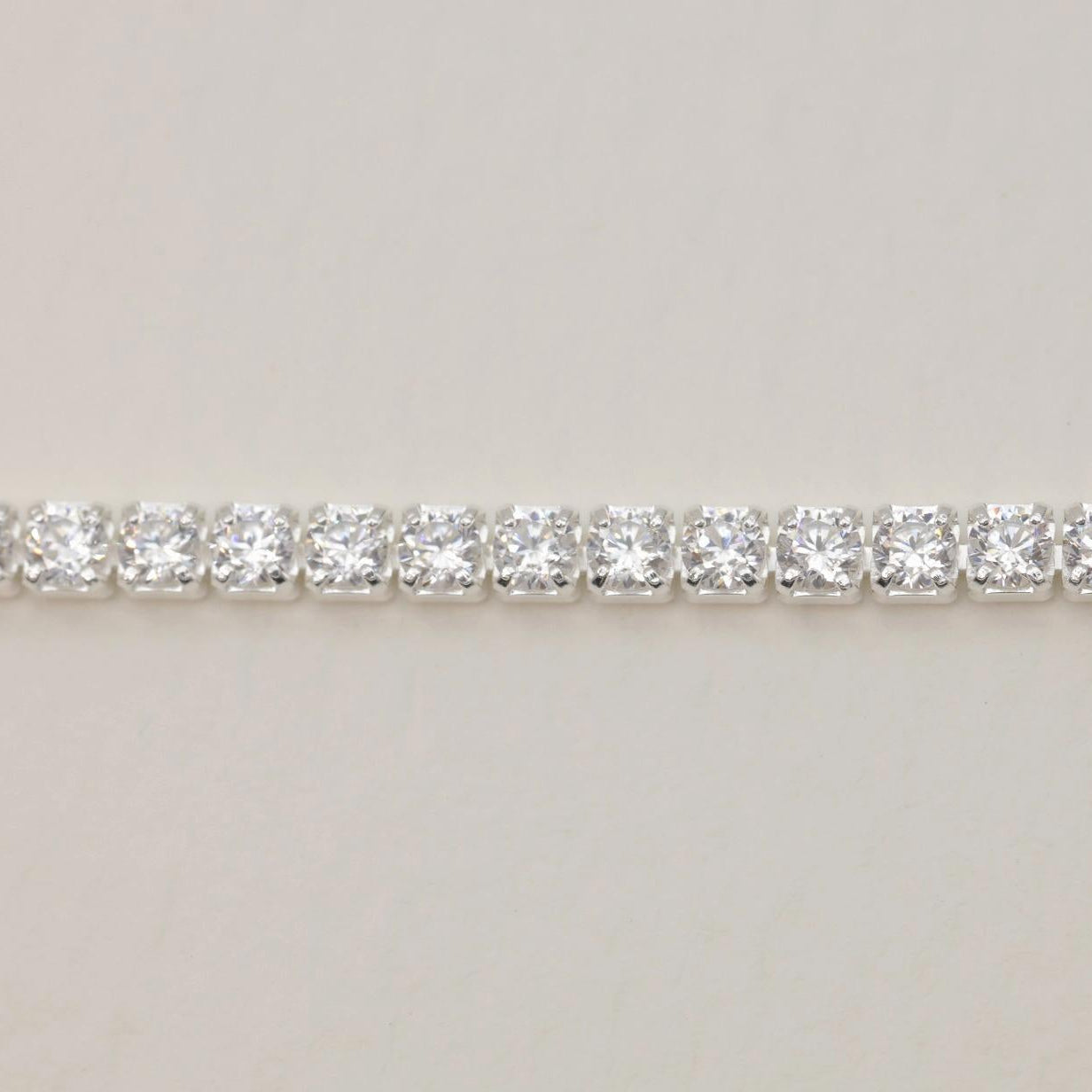 Close-up of Édith adjustable sterling silver tennis bracelet with cubic zirconia stones

